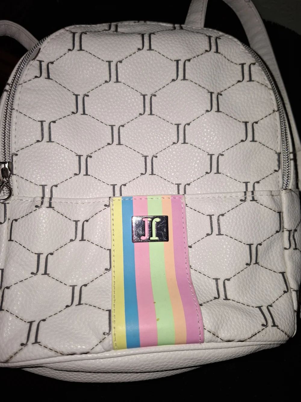 Justice mini backpack featuring an all-over 
